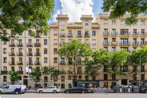 a large building with cars parked in front of it at For You Rentals COZY APARTMENT IN BARRIO SALAMANCA JOG48 in Madrid