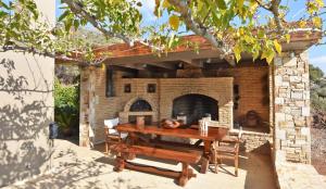 A patio or other outdoor area at Luxurious Villa Dionysus with a swimming pool and sea view
