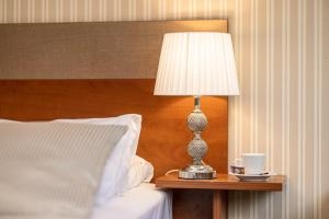 Postel nebo postele na pokoji v ubytování Palanga Park Hotel