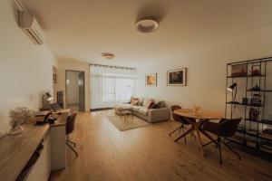 a living room with a couch and a table at Beaufort Street Gem 1br Urban Retreat in Perth