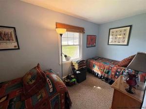 a bedroom with two beds and a window at Close to skiing and hiking, walk to main street in Tannersville
