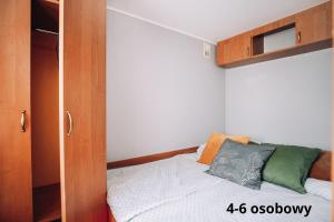 Łóżko lub łóżka w pokoju w obiekcie Słoneczne domki