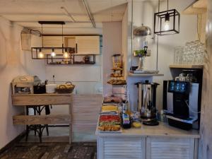 a kitchen with a counter with food on it at La Merveille in Solina