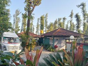 a white van parked in front of a house at FoRest cottage coorg in Madikeri