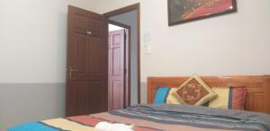 Postel nebo postele na pokoji v ubytování Trăng Non House