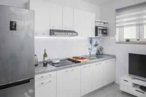 Kuchyňa alebo kuchynka v ubytovaní Apartment Sea Pearl