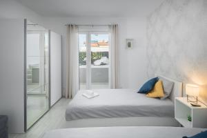 Posteľ alebo postele v izbe v ubytovaní Apartment Sea Pearl