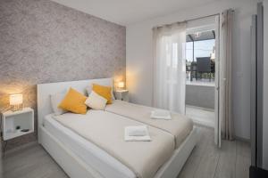 Postel nebo postele na pokoji v ubytování Apartment Sea Pearl