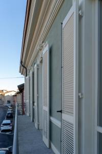 a row of shutters on the side of a building at Madamin 