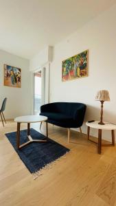 a living room with two tables and a couch at ApartmentInCopenhagen Apartment 1527 in Copenhagen