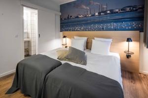 Katil atau katil-katil dalam bilik di KOMPAS Hotel Aalborg