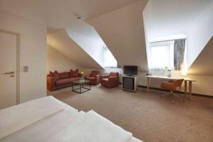 TV a/nebo společenská místnost v ubytování GHOTEL hotel & living Kiel