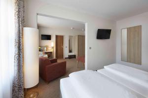 Postel nebo postele na pokoji v ubytování GHOTEL hotel & living Kiel