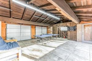 a garage with a ping pong table in a room at 301 Rochelle in Irving