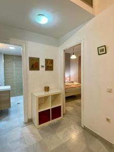 A bed or beds in a room at Archeros Oasis