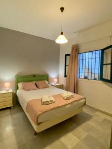 A bed or beds in a room at Archeros Oasis