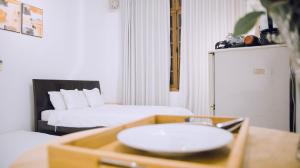 Postel nebo postele na pokoji v ubytování Fortuna Homestay