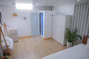 Postel nebo postele na pokoji v ubytování Fortuna Homestay