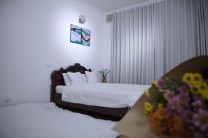 Postel nebo postele na pokoji v ubytování Fortuna Homestay