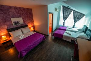 Postel nebo postele na pokoji v ubytování Hotel Oasis