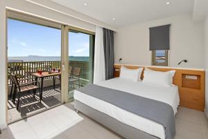 Ένα ή περισσότερα κρεβάτια σε δωμάτιο στο Thalassa Suites