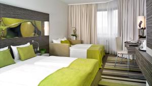 Postel nebo postele na pokoji v ubytování Mercure Hotel Koblenz