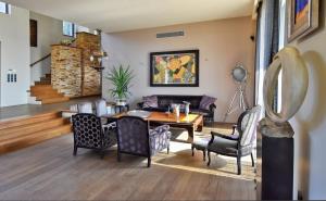 A seating area at Luxurious Villa Dionysus with a swimming pool and sea view