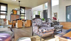 A seating area at Luxurious Villa Dionysus with a swimming pool and sea view
