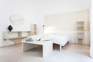 Postel nebo postele na pokoji v ubytování Suite Artus + 32 fotografií