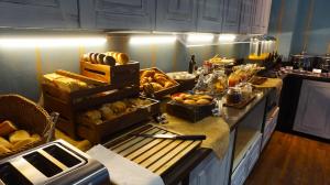 a kitchen with a bunch of food on a counter at Hotel Indigo Madrid - Gran Vía by IHG in Madrid