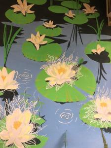 a group of pink water lilies in a pond at Caju Hostel in Alter do Chao