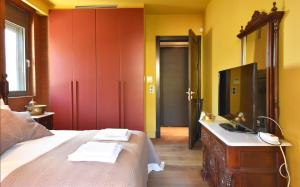 A bed or beds in a room at Luxurious Villa Dionysus with a swimming pool and sea view