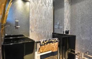 A bathroom at Luxurious Villa Dionysus with a swimming pool and sea view