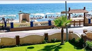 a view of the beach from a resort at Renovated super Lux Apartment Chalet Direct sea view 2 bed rooms in Alexandria Al Mamourah شاليه الترا لوكس شاطىء المعموره الاسكندريه دور اول على البحر مباشره مع كارنيهات الدخول طوال السنه و الشاطىء الخاص من اول مايو لنهايه اكتوبر للعائلات فقط in Alexandria
