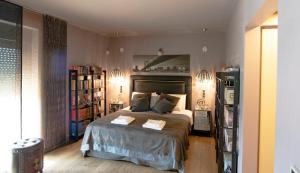 A bed or beds in a room at Luxurious Villa Dionysus with a swimming pool and sea view
