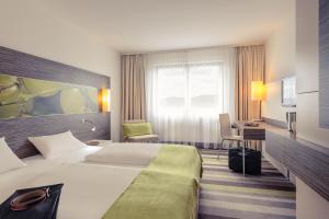 Postel nebo postele na pokoji v ubytování Mercure Hotel Koblenz