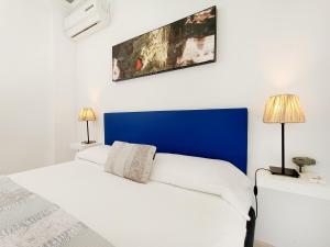 Ein Bett oder Betten in einem Zimmer der Unterkunft La Manga Norte Villa - 6509