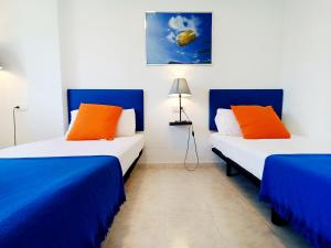 Ein Bett oder Betten in einem Zimmer der Unterkunft La Manga Norte Villa - 6509