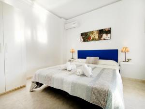 Ein Bett oder Betten in einem Zimmer der Unterkunft La Manga Norte Villa - 6509