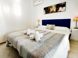 Ein Bett oder Betten in einem Zimmer der Unterkunft La Manga Norte Villa - 6509