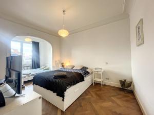 Letto o letti in una camera di Cosy Apartment Brussels - Champ de Mars