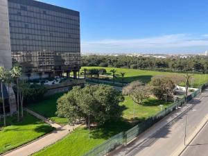 an aerial view of a park next to a building at Spacious 3 bedroom apartment in Casablanca