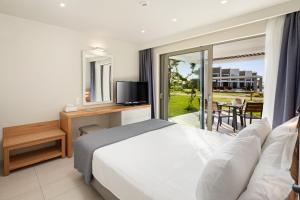 Ένα ή περισσότερα κρεβάτια σε δωμάτιο στο Thalassa Suites