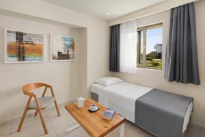 Ένα ή περισσότερα κρεβάτια σε δωμάτιο στο Thalassa Suites
