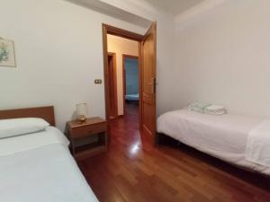 Postel nebo postele na pokoji v ubytování Casa Pie' di Monte