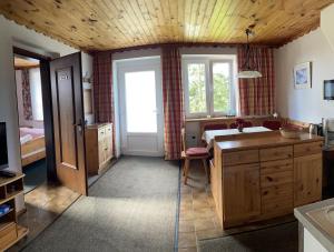 a bedroom with a bed and a desk in a room at Stockerhaus in Klippitztorl