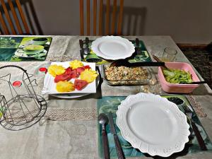 a table with plates of food on top of it at Riambel Paradise Inn Luxury Room in Riambel