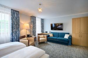 TV a/nebo společenská místnost v ubytování Hotel Lechnerhof Unterföhring