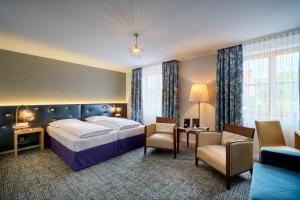 Postel nebo postele na pokoji v ubytování Hotel Lechnerhof Unterföhring