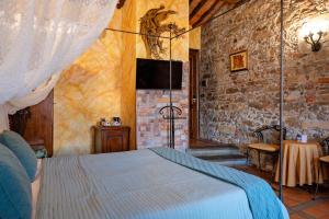 Postel nebo postele na pokoji v ubytování Luxury Corte Di Re Artù